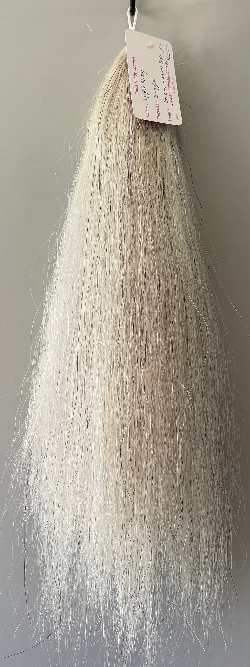 Very light grey single  thickness.     (1 times ) 56 cm natural end pony length