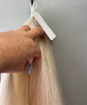 Weighted pally off white ( untoned white ) Double plus (2.5 times ) 62 cm cut end Final weight 700g