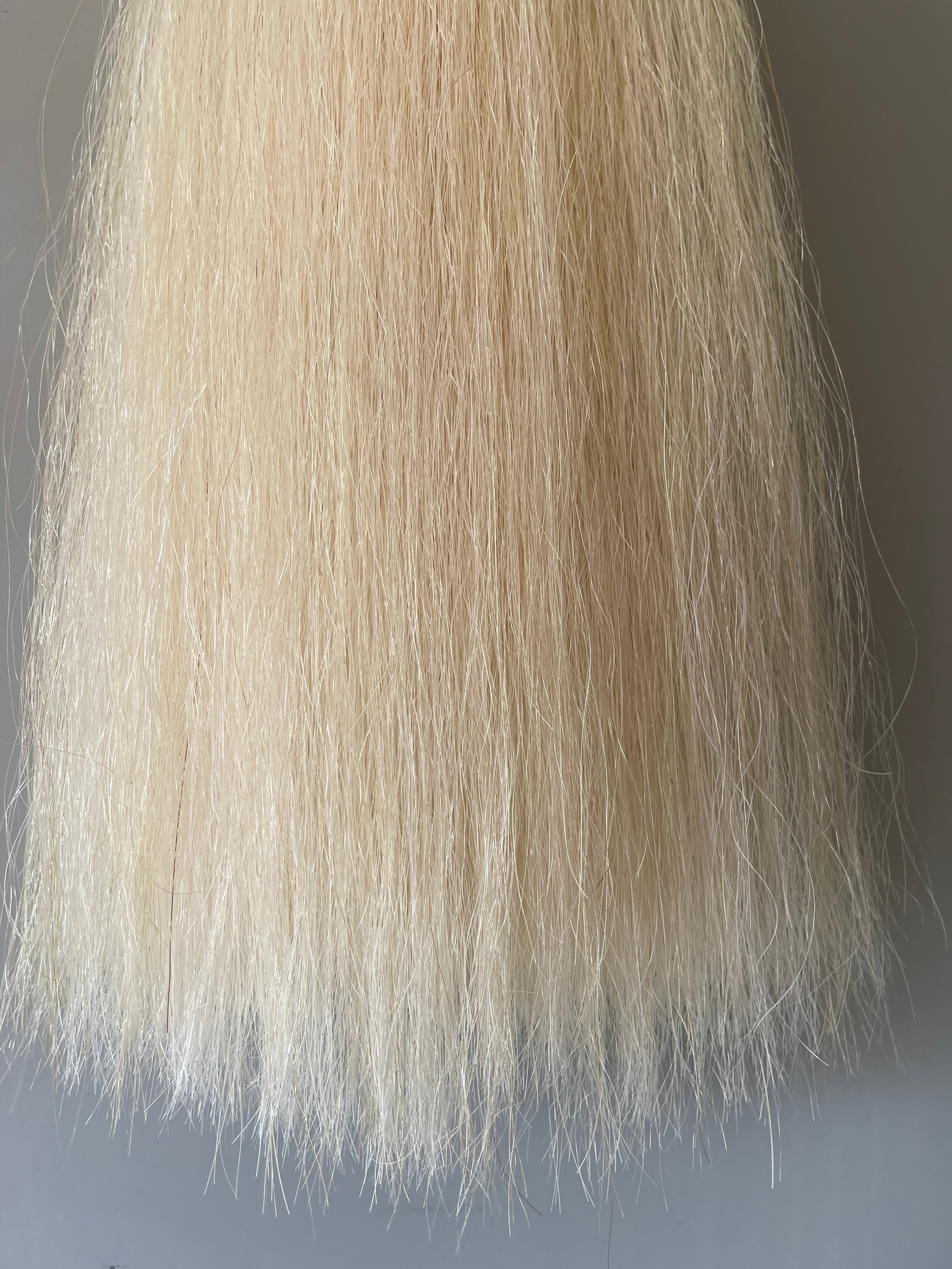 Weighted pally off white ( untoned white ) Double plus (2.5 times ) 62 cm cut end Final weight 700g