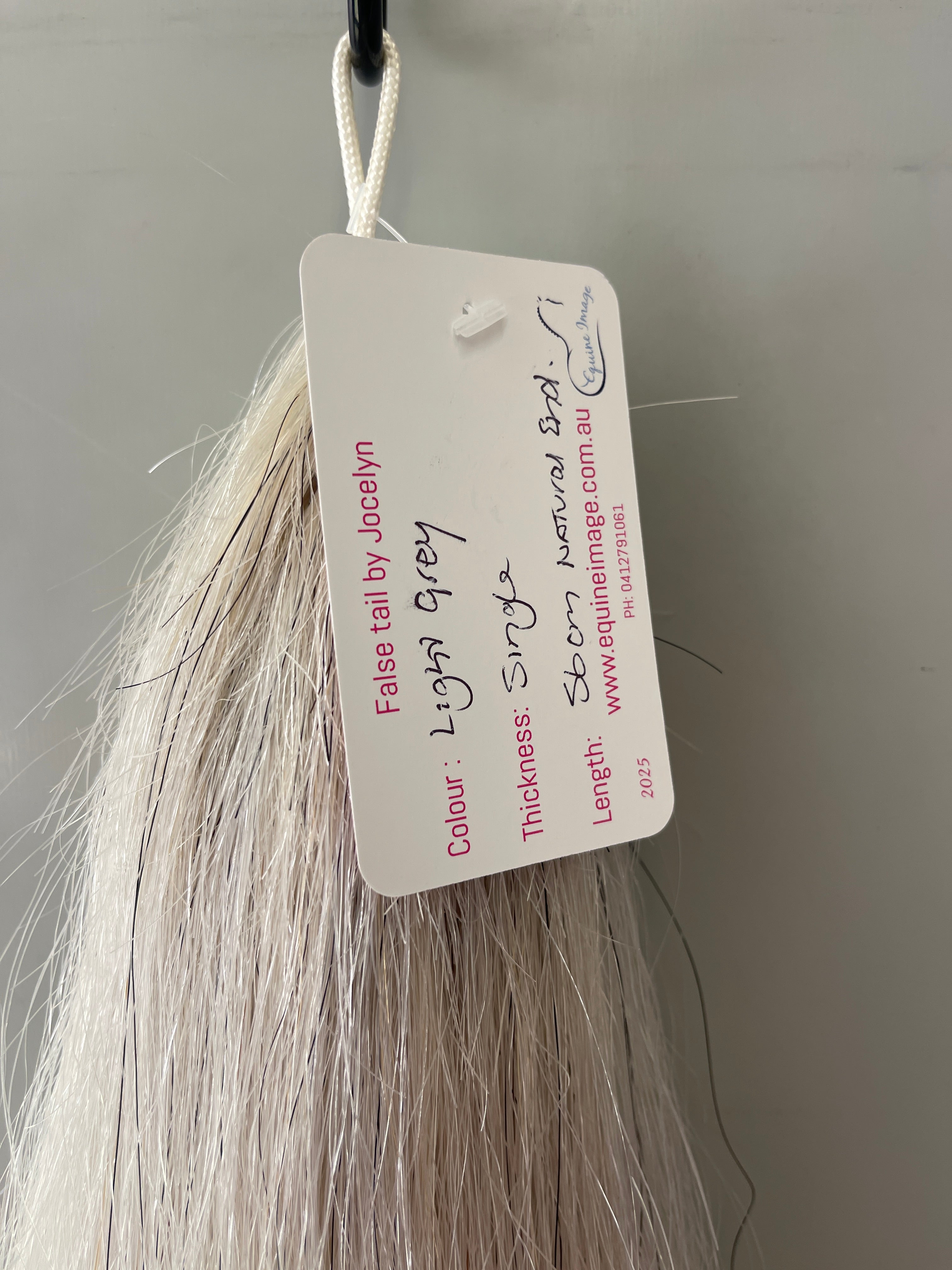 Very light grey single  thickness.     (1 times ) 56 cm natural end pony length